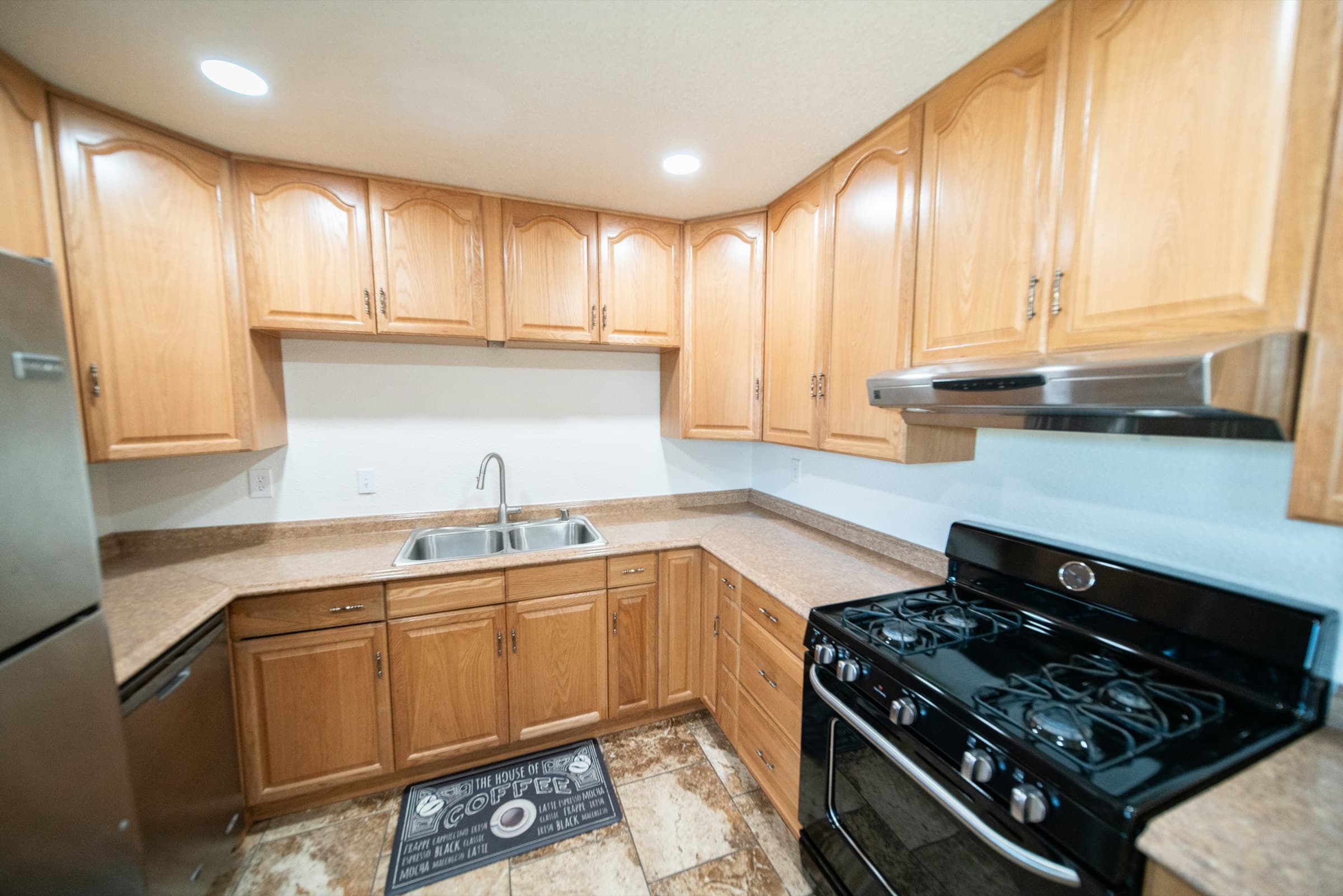 Original brown kitchen with oak cabinets before renovation