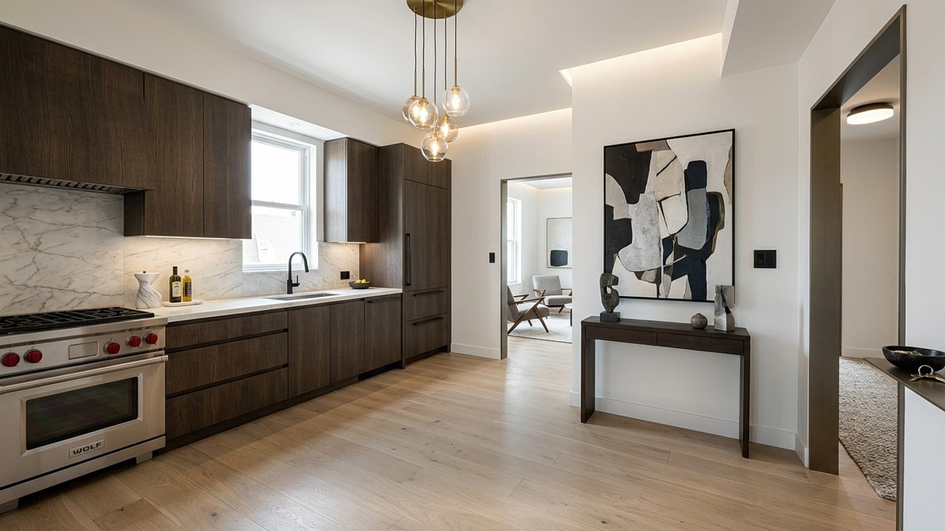Fully renovated modern kitchen with dark wood cabinetry, marble backsplash and designer lighting