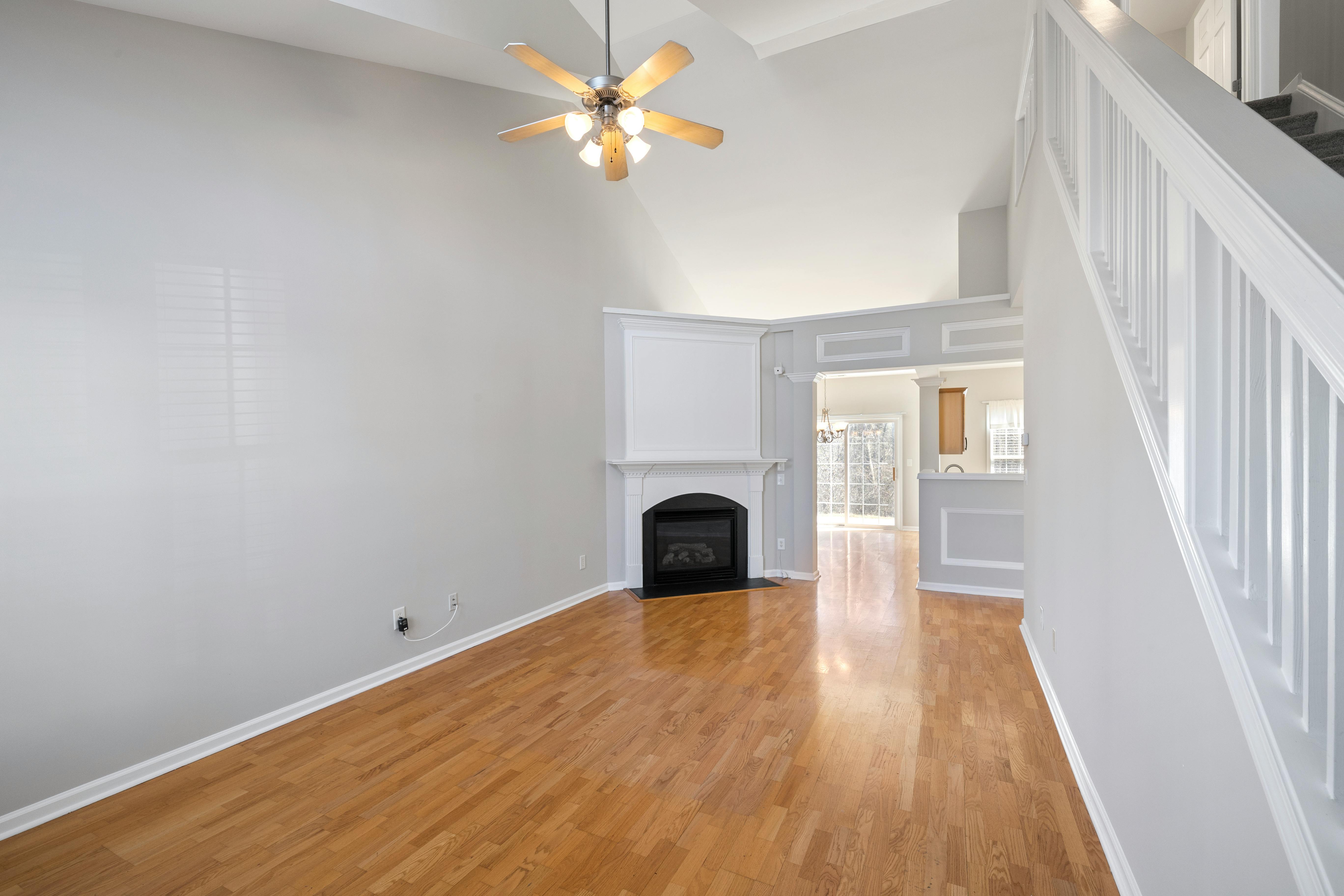 Empty room with staircase before staging